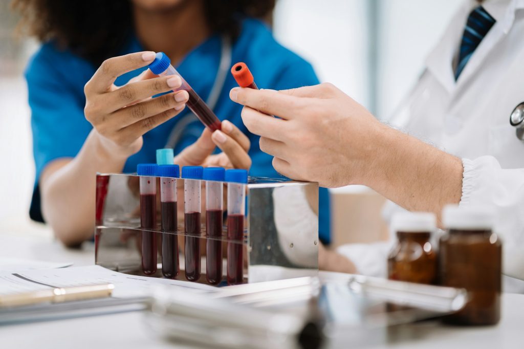 medical team analysis the blood test examination results and medication usage of the patient